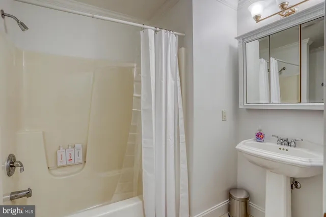 a bathroom with a sink and mirror