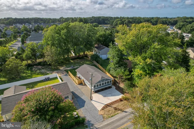 an aerial view of a house with a garden