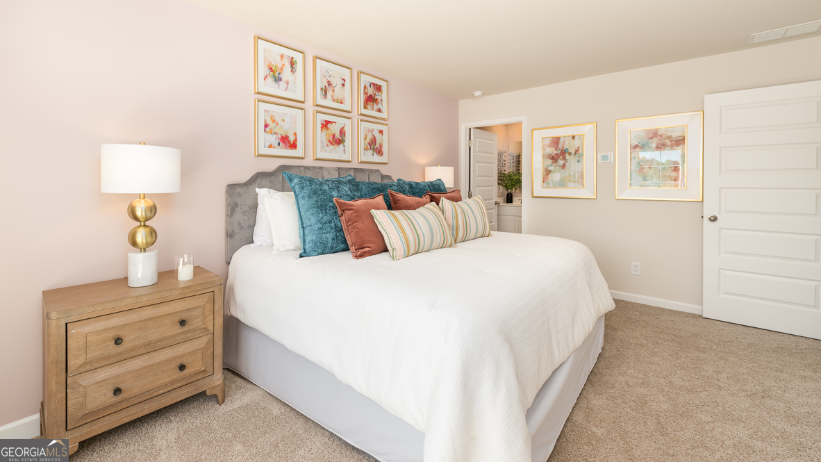 2086 Moss Hill Road Stone Mountain, GA 30088 - Photo 23 of 38 a bedroom with a bed and a night stand