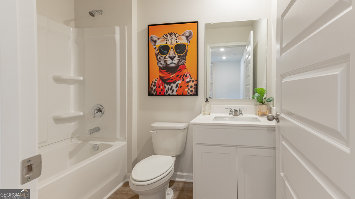 2086 Moss Hill Road Stone Mountain, GA 30088 - Photo 29 of 38 a bathroom with a sink a toilet and shower