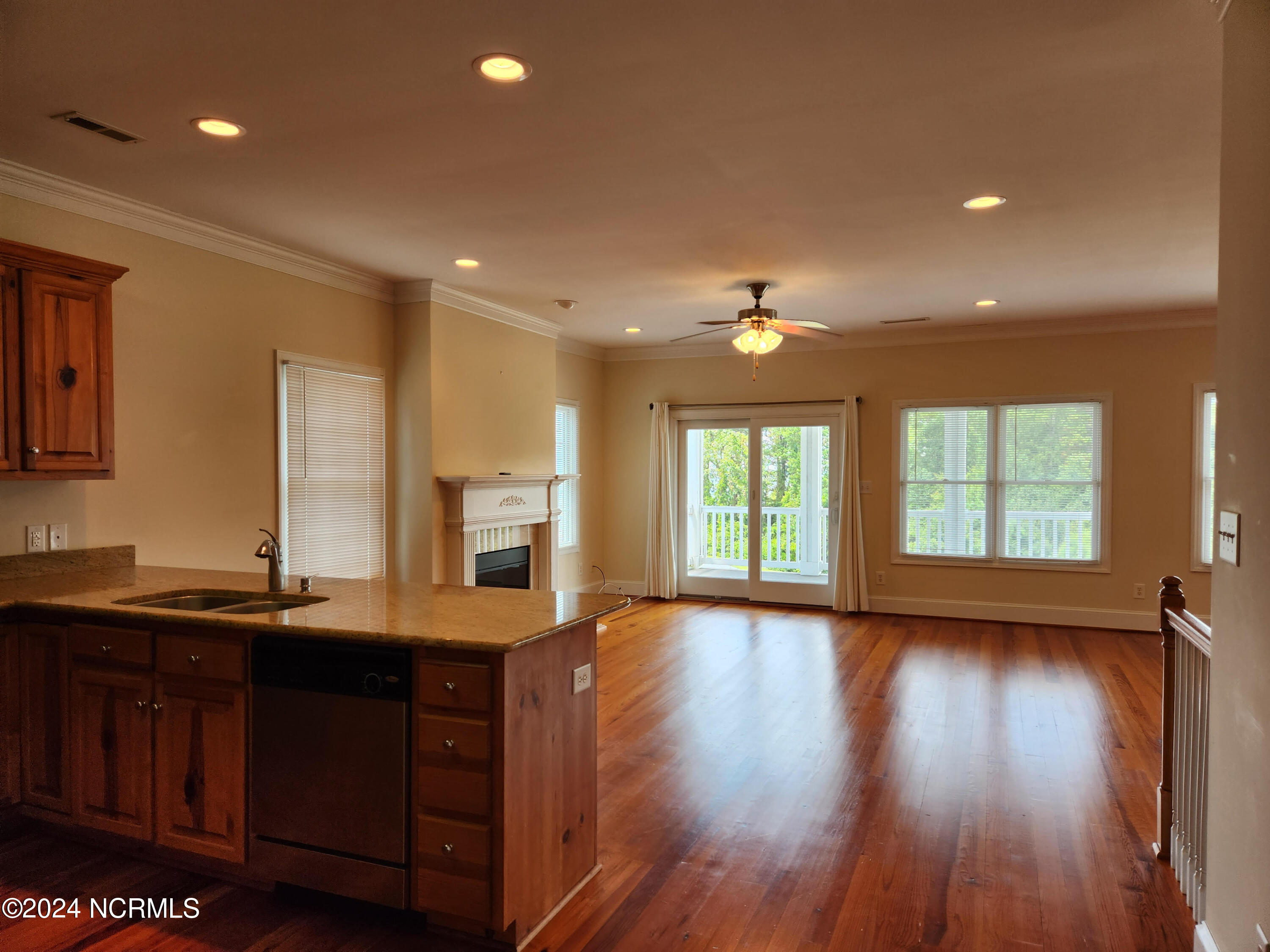 1129 Bennett Road, Unit 1A Minnesott Beach, NC 28510 - Photo 35 of 35 Open floor plan with a balcony, a fireplace and a view.