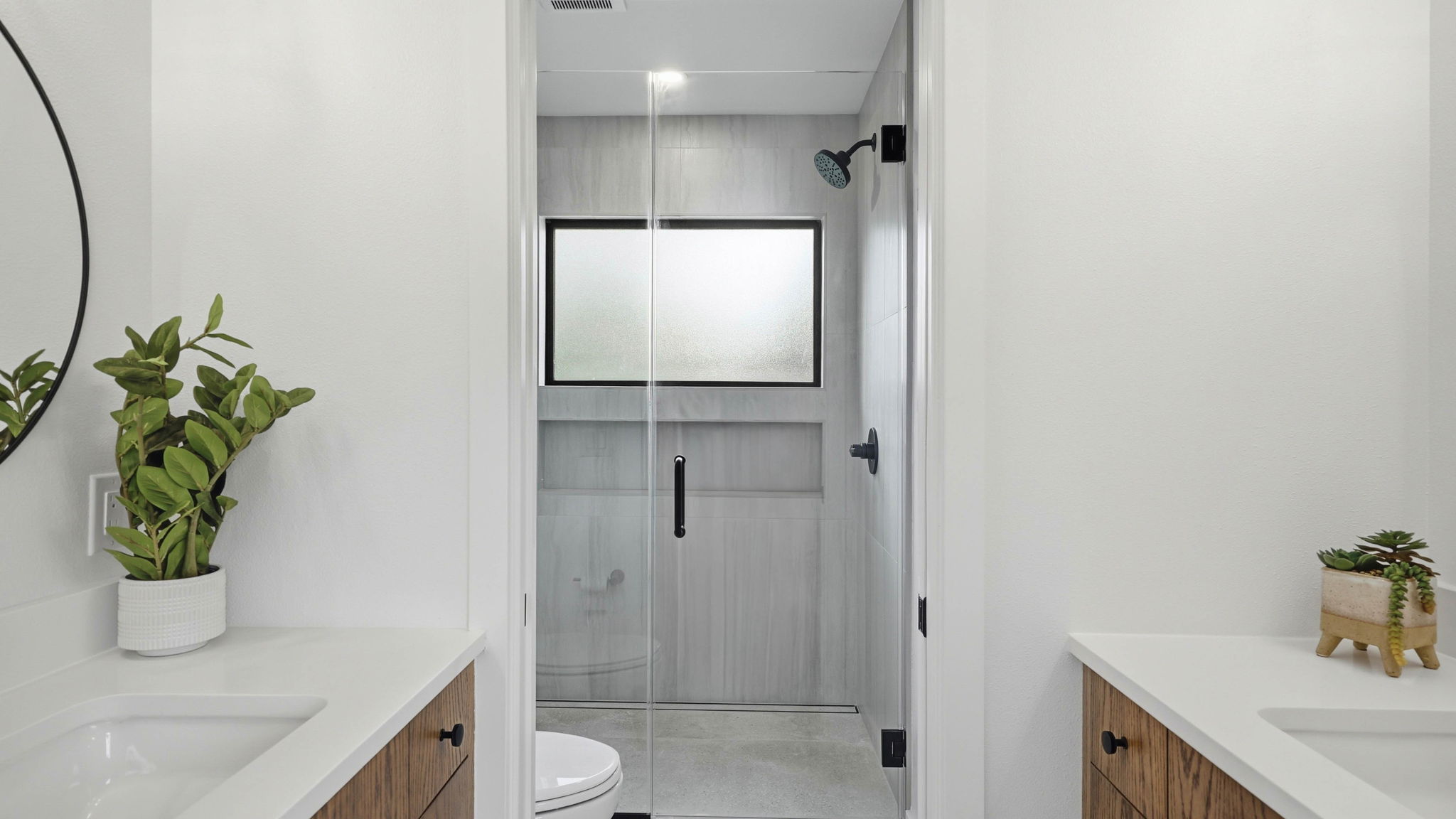 300 Lightsey Road, Unit 2 Austin, TX 78704 - Photo 25 of 28 Bathroom featuring vanity and a shower stall