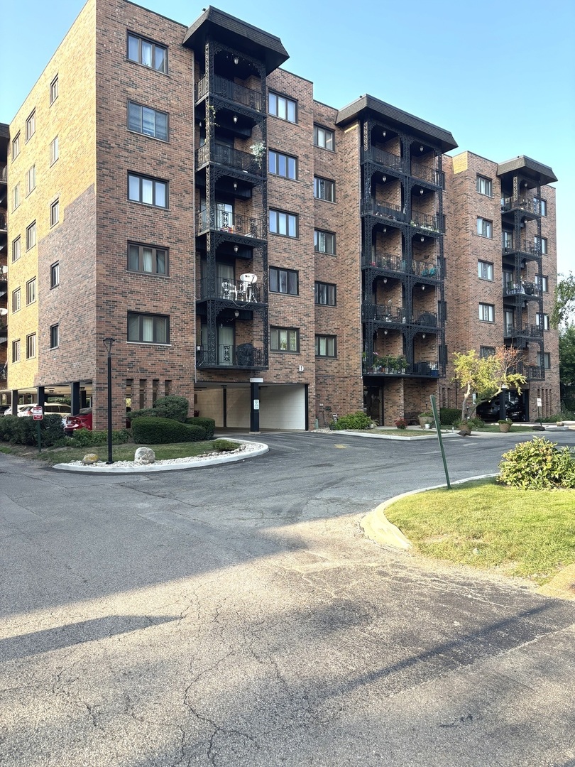 9332 Landings Lane, Unit 504 Des Plaines, IL 60016 - Photo 1 of 18 a view of building with a street