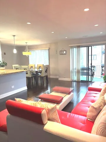 a living room with furniture and a table