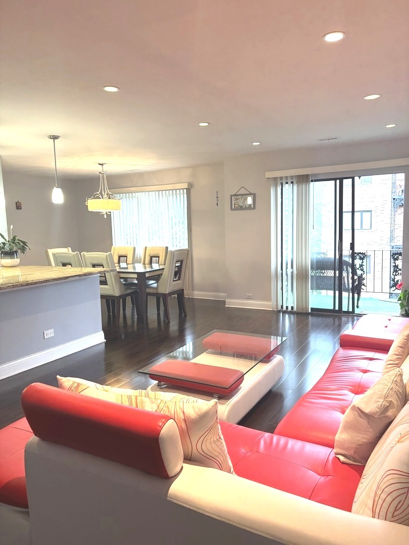 9332 Landings Lane, Unit 504 Des Plaines, IL 60016 - Photo 11 of 18 a living room with furniture and a table