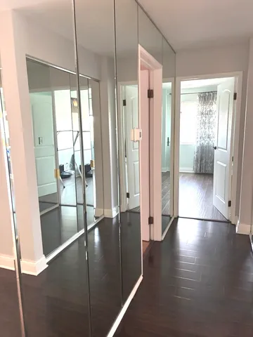 a view of entryway with wooden floor