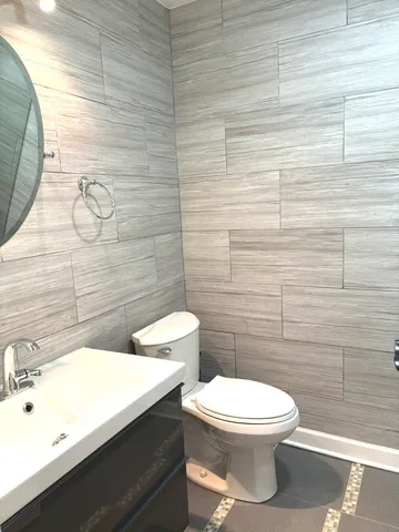 a bathroom with a toilet and a sink