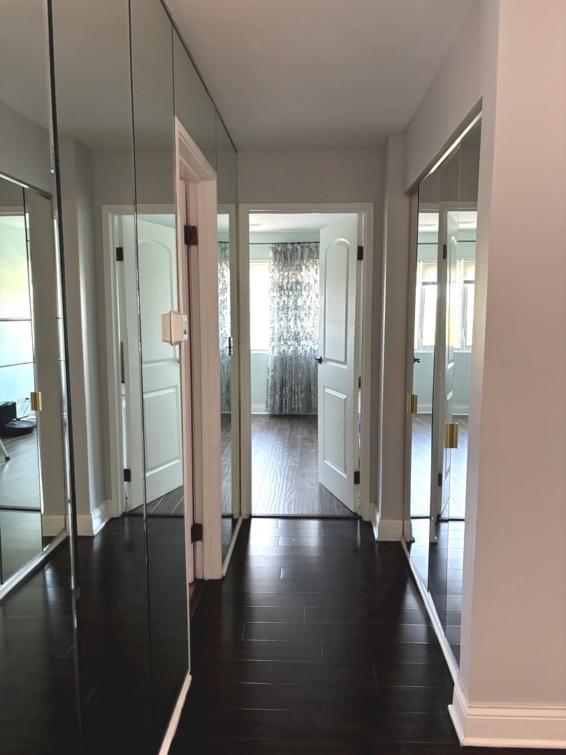 9332 Landings Lane, Unit 504 Des Plaines, IL 60016 - Photo 3 of 18 a view of gallery with wooden floor