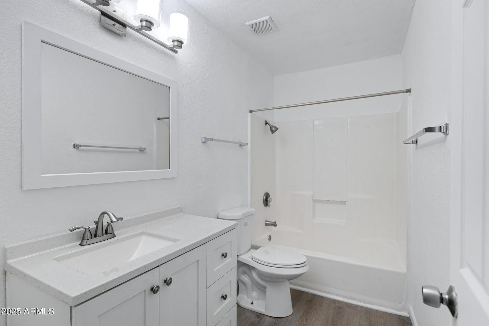 18202 North Cave Creek Road Phoenix, AZ 85032 - Photo 13 of 20 a bathroom with a granite countertop sink toilet a mirror and shower