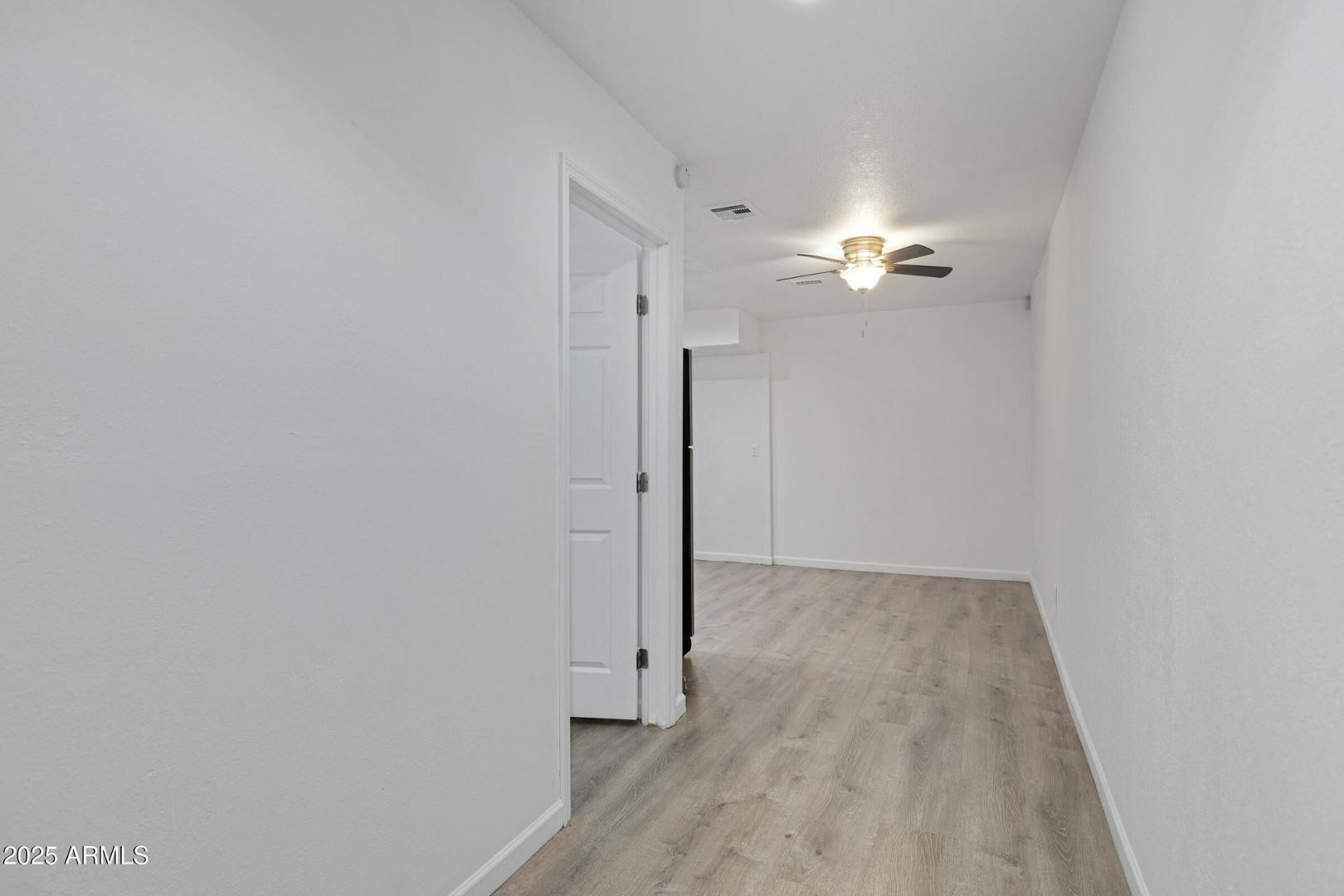 18202 North Cave Creek Road Phoenix, AZ 85032 - Photo 4 of 20 a view of a hallway with chandelier fan