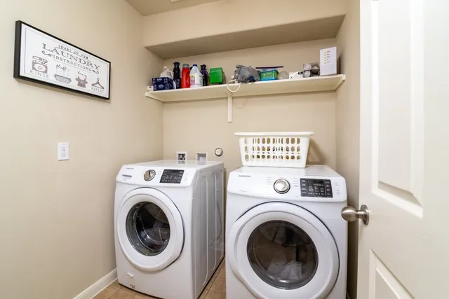 a view of washer and dryer in a utility room