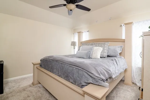 a bedroom with a bed and window