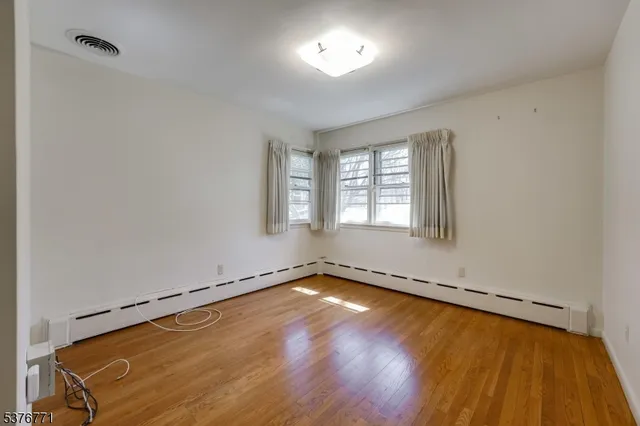a bathroom with a double vanity sink and mirror