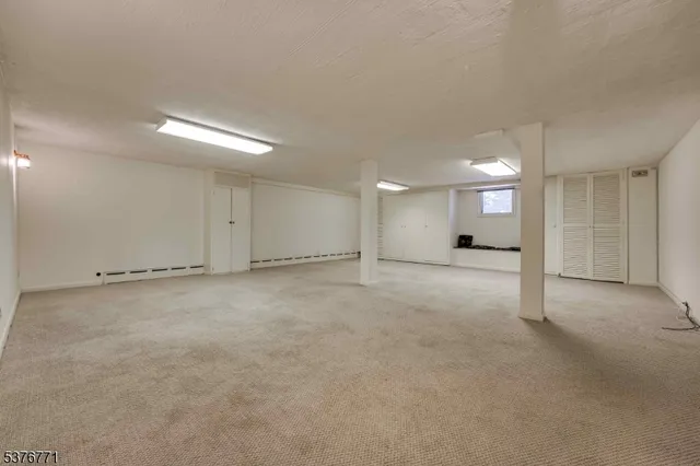 an empty room with a building and stairs
