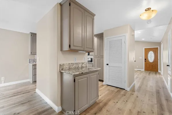 a view of a kitchen cabinets and wooden floor