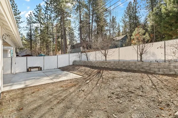 a view of a yard with snow on the road