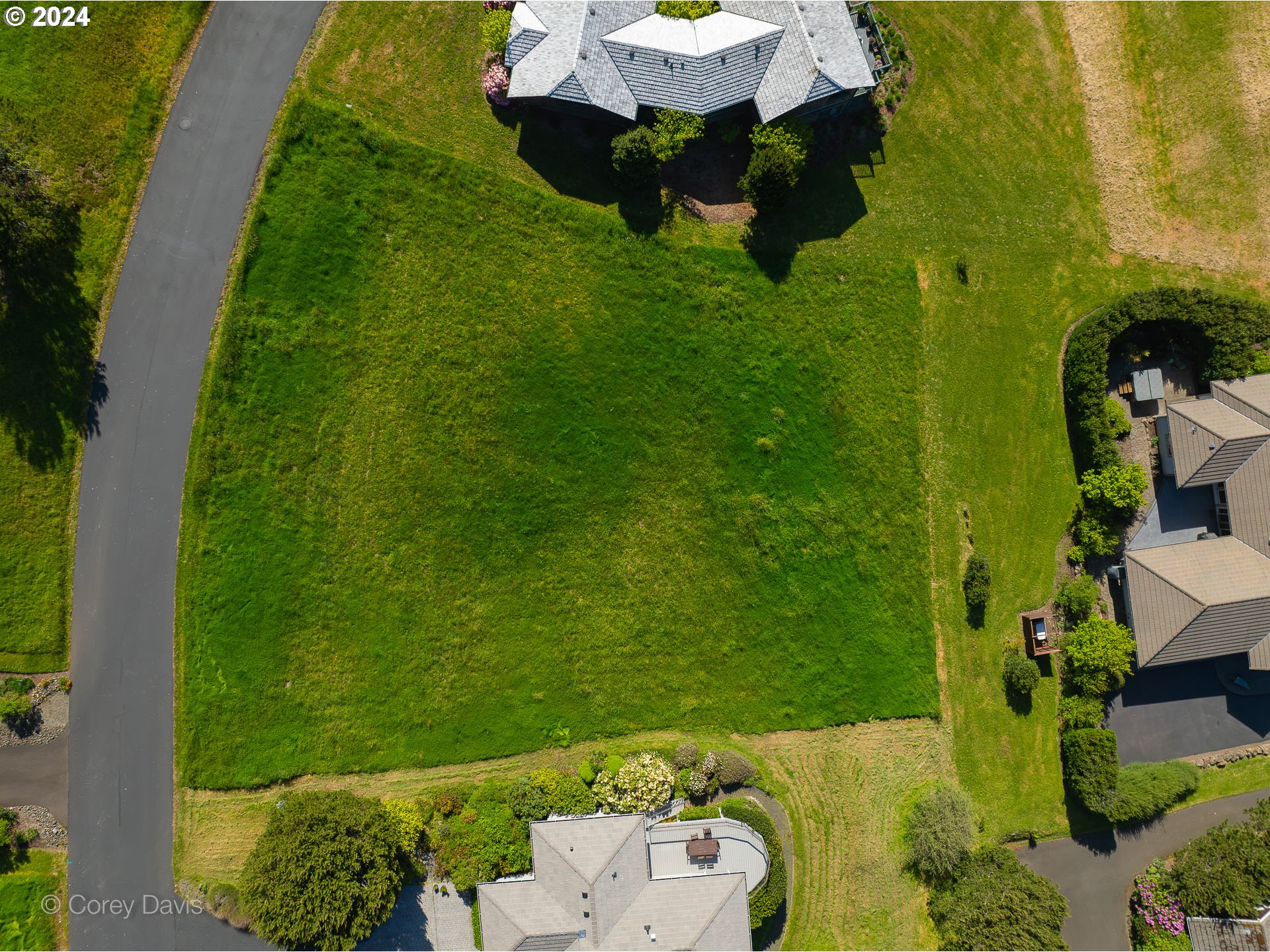 Meadow Loop, Unit 14 Nehalem, OR 97131 - Photo 14 of 22 a backyard of a house with lots of green space