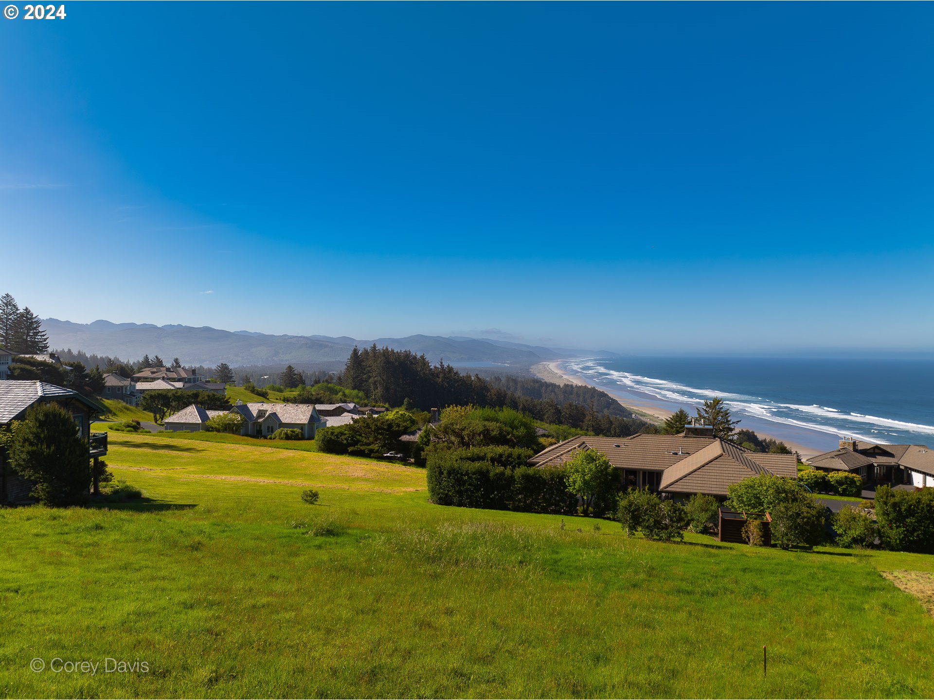 Meadow Loop, Unit 14 Nehalem, OR 97131 - Photo 8 of 22 a view of a lake with houses in the back