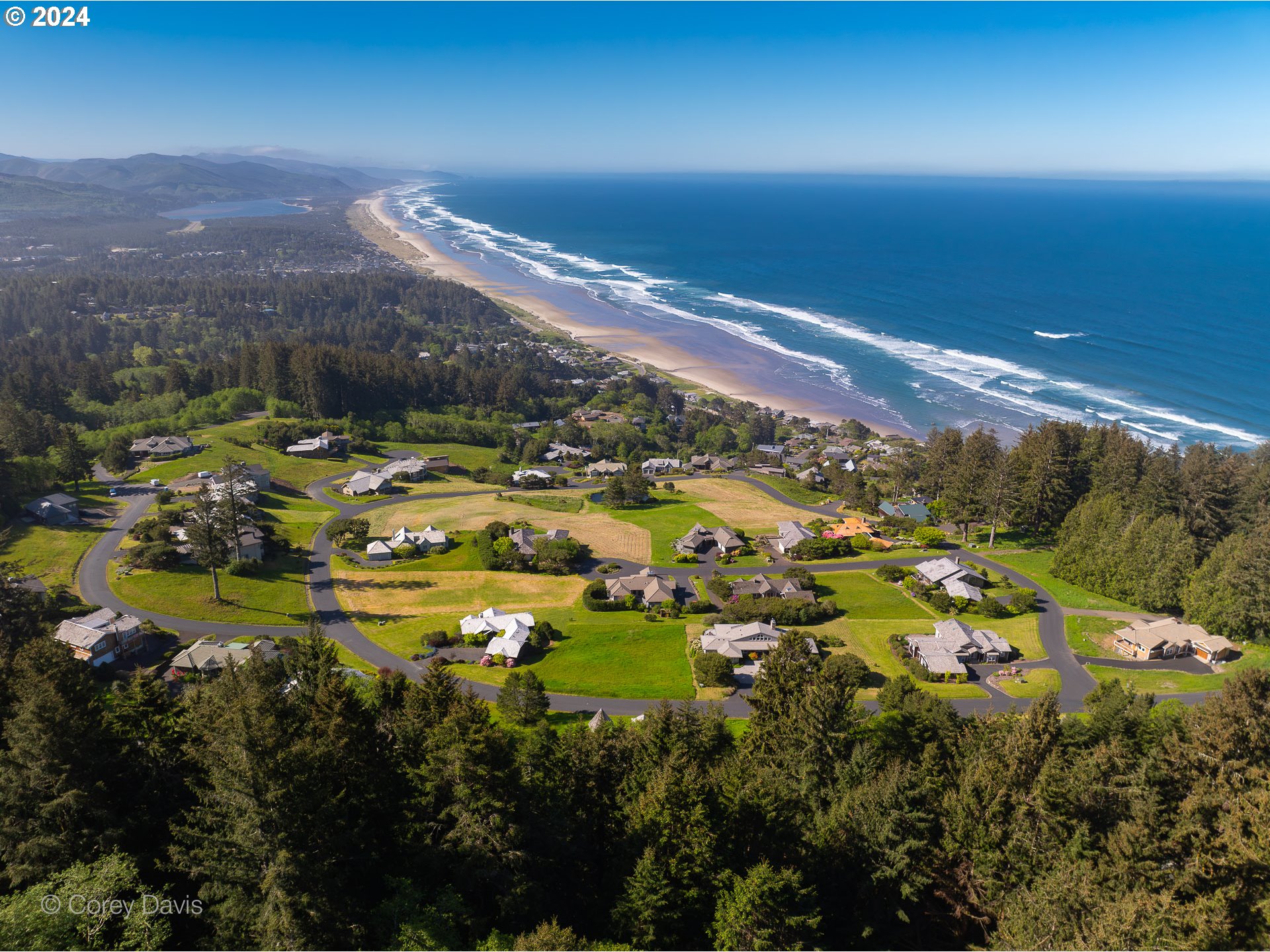 Meadow Loop, Unit 14 Nehalem, OR 97131 - Photo 10 of 22 an aerial view of residential houses with outdoor space and trees