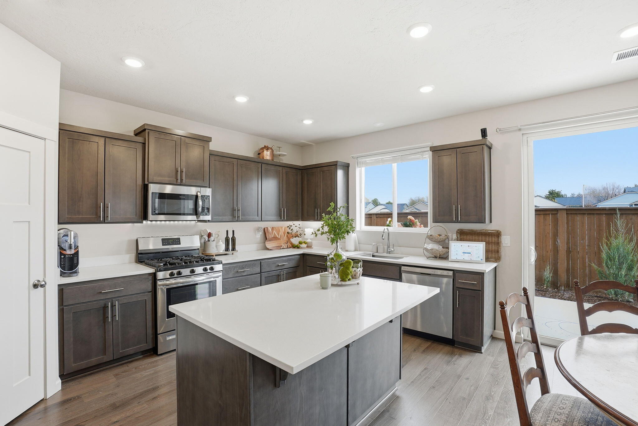4015 Southwest Quartz Place Redmond, OR 97756 - Photo 10 of 35 a kitchen with a sink stove and refrigerator