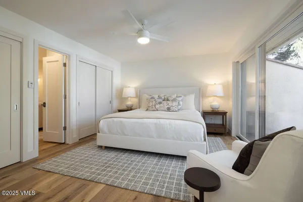 a bedroom with a bed and cabinets