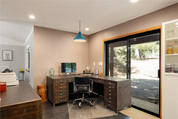 a kitchen with granite countertop white cabinets and stainless steel appliances
