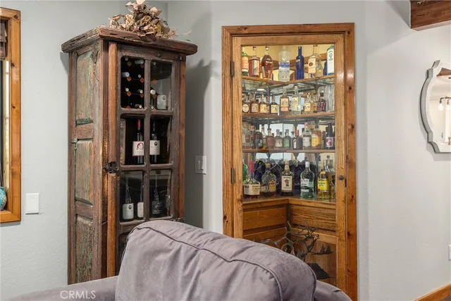 a bedroom with a bed and a chair