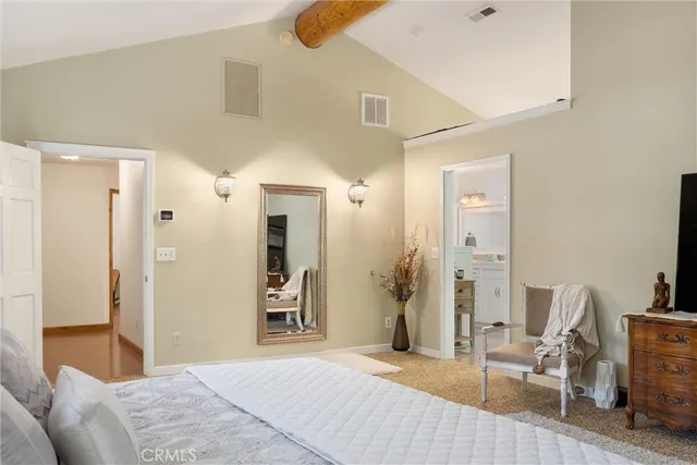 a view of a room with furniture and a fan