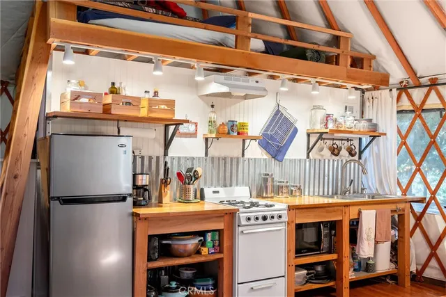 a house with trees in the background