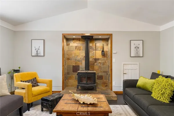 a living room with furniture and a rug