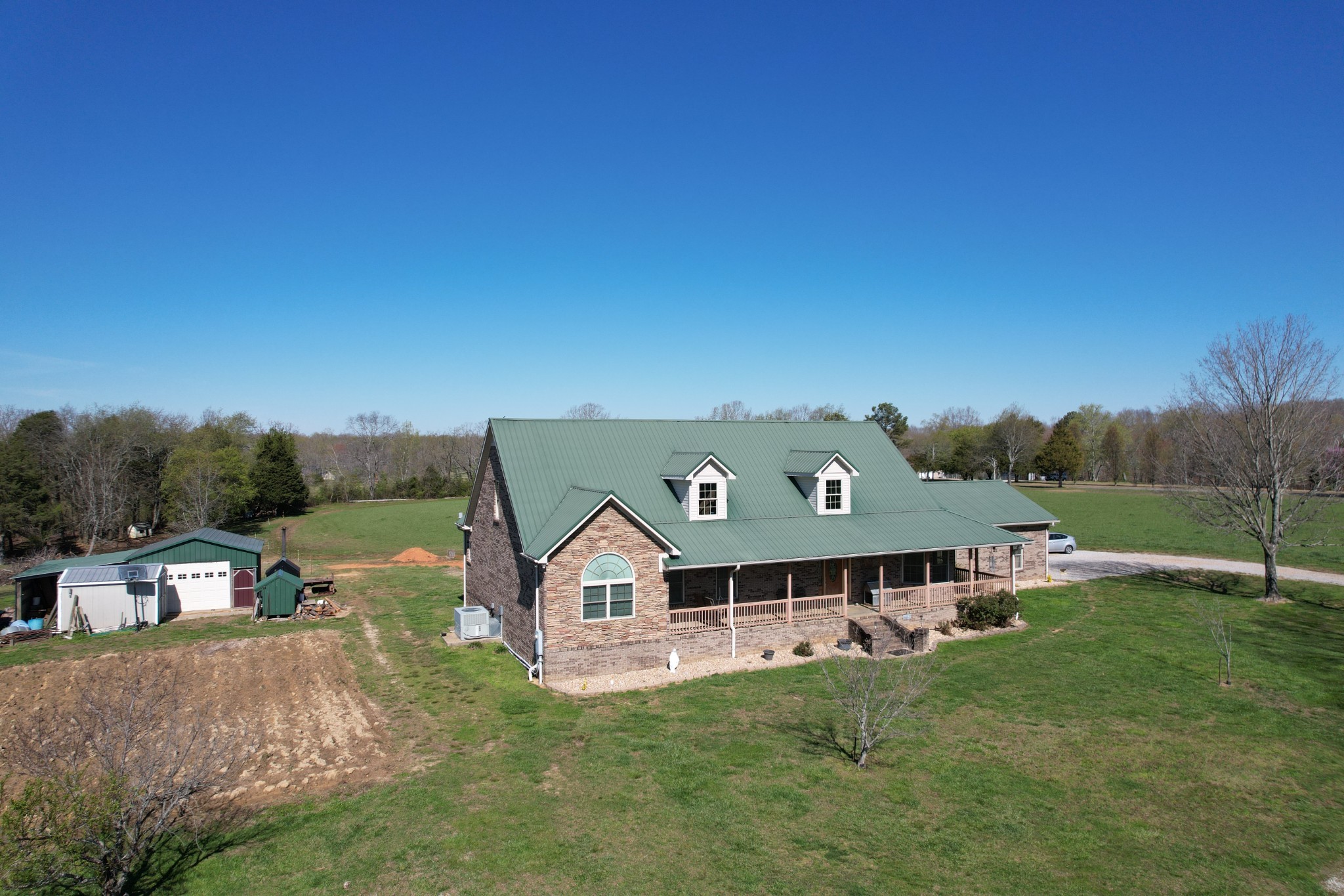 295 White Road Pulaski, TN 38478 - Photo 1 of 49 a front view of a house with a yard
