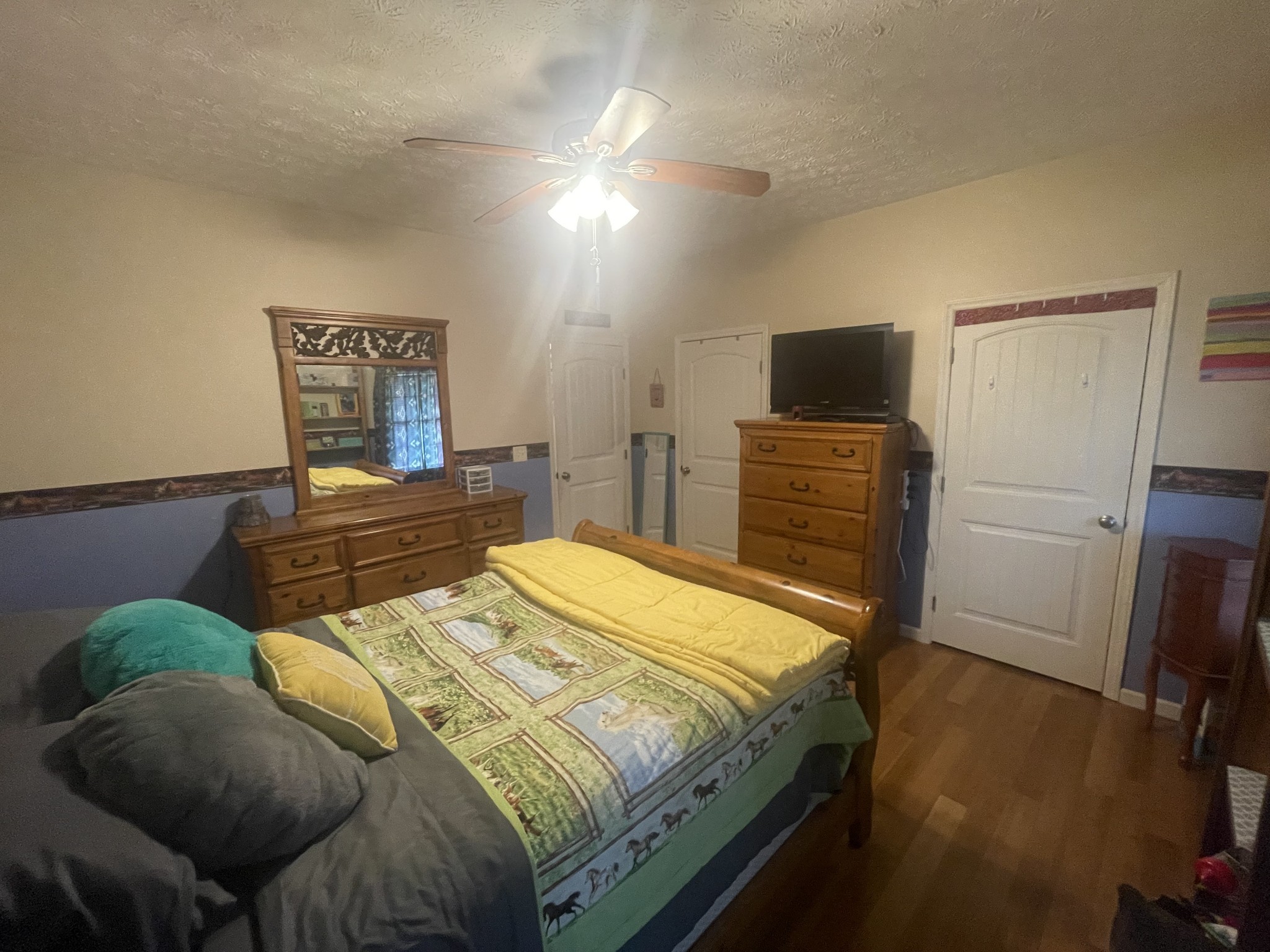 295 White Road Pulaski, TN 38478 - Photo 33 of 49 a bedroom with a bed and flat screen tv