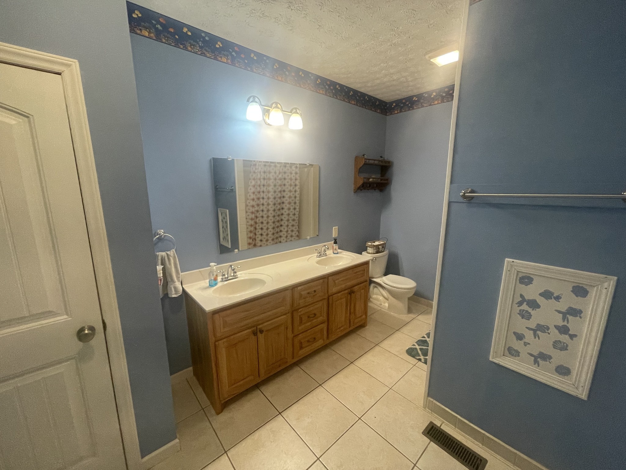 295 White Road Pulaski, TN 38478 - Photo 35 of 49 a bathroom with a sink mirror vanity and toilet