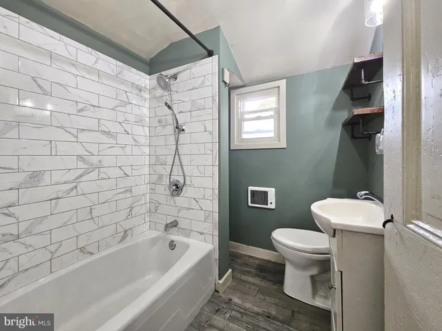 a bathroom with a toilet and a bathtub