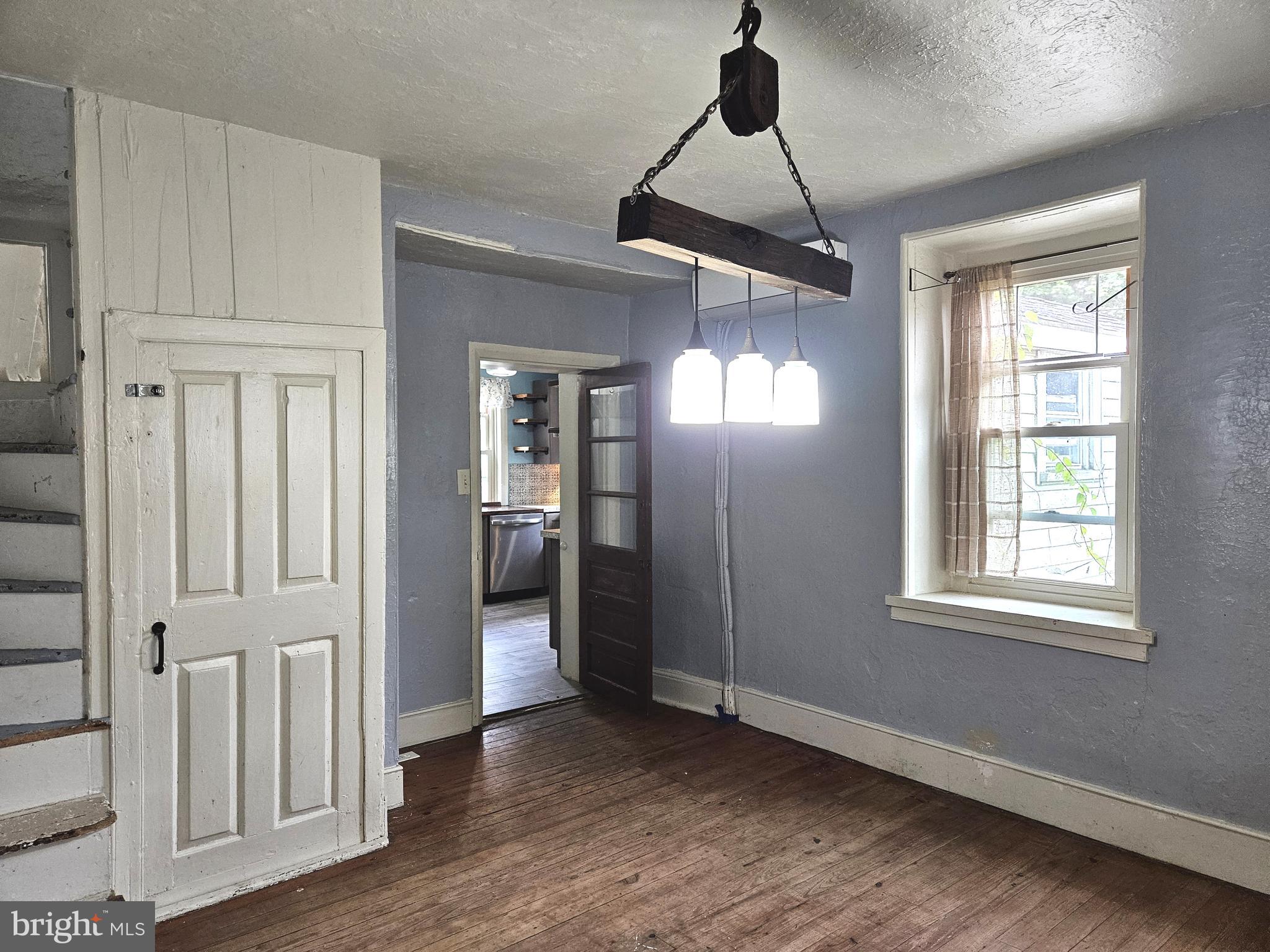 683 North Manor Road Elverson, PA 19520 - Photo 6 of 14 an empty room with wooden floor closet and windows