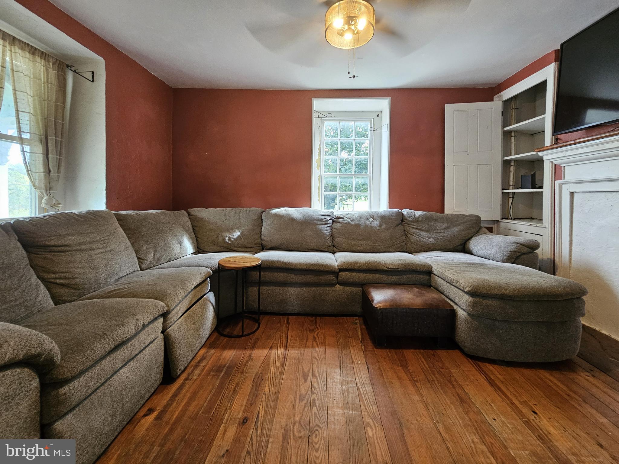683 North Manor Road Elverson, PA 19520 - Photo 7 of 14 a living room with furniture and a flat screen tv