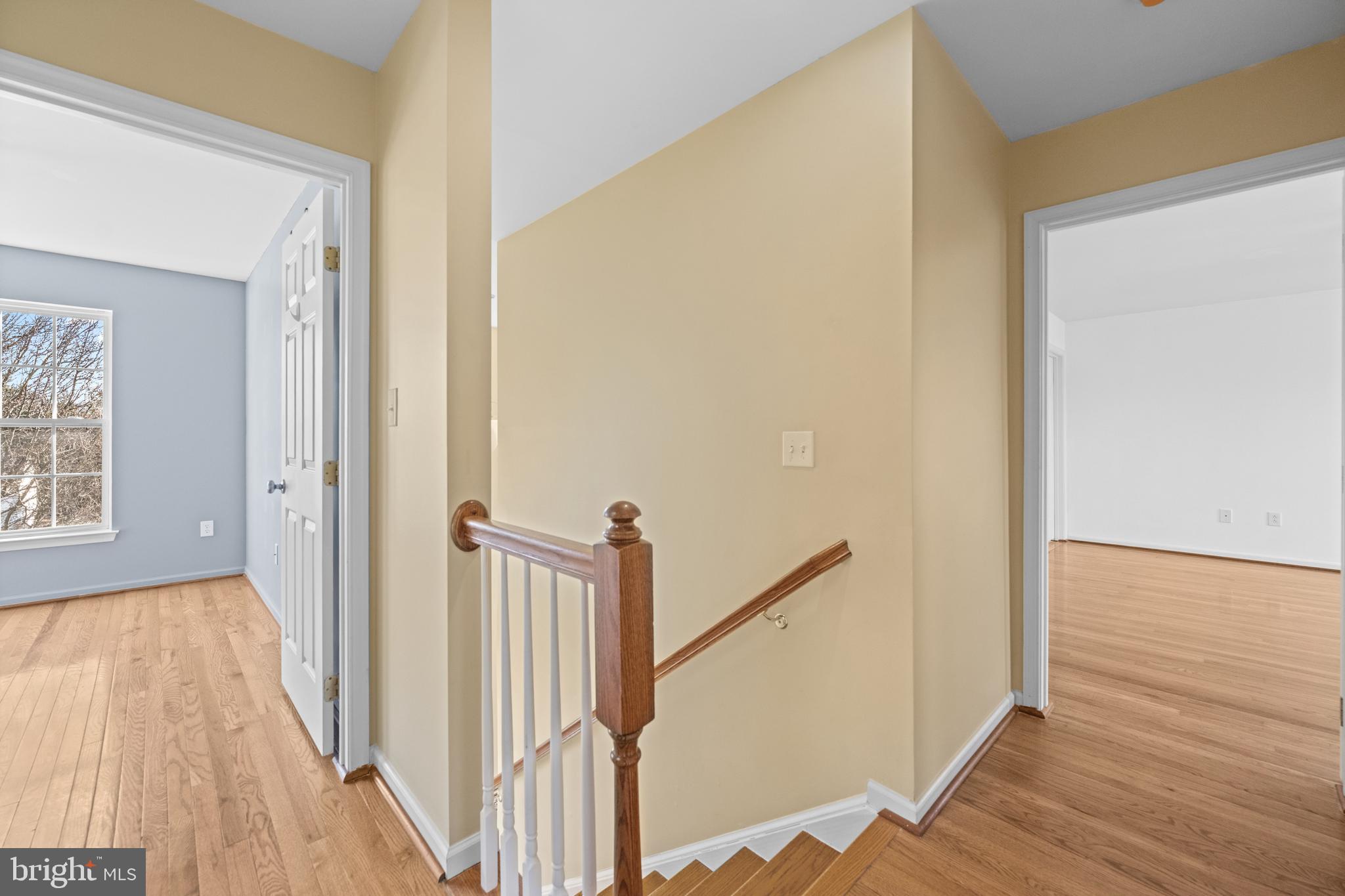 6 Huntingdon Court Marcus Hook, PA 19061 - Photo 18 of 35 a view of a hallway with wooden floor and staircase