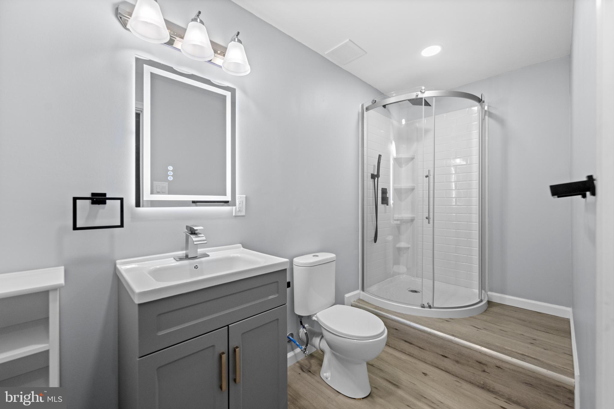 6 Huntingdon Court Marcus Hook, PA 19061 - Photo 26 of 35 a bathroom with a sink a toilet and shower