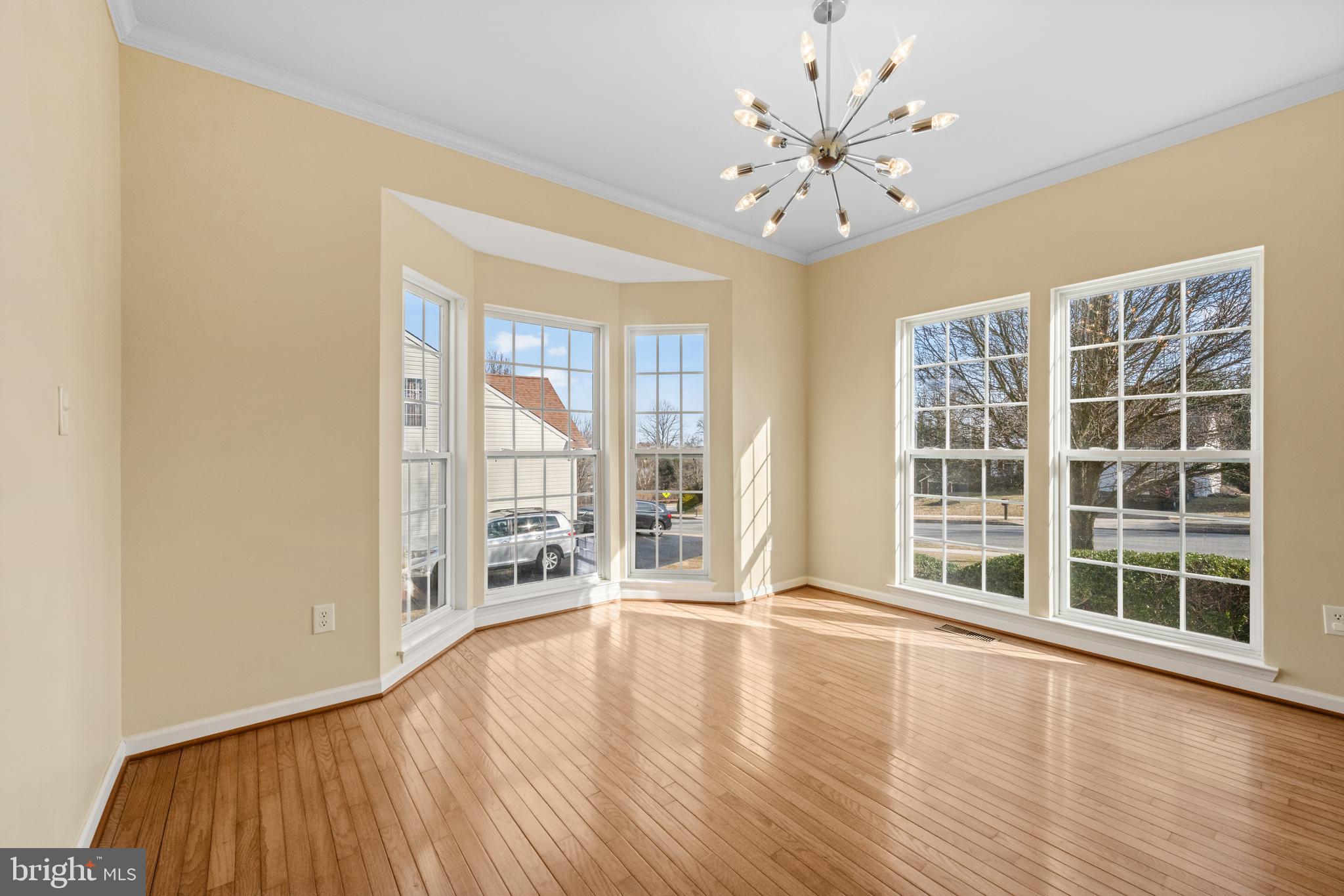 6 Huntingdon Court Marcus Hook, PA 19061 - Photo 5 of 35 a view of an empty room with a window and wooden floor