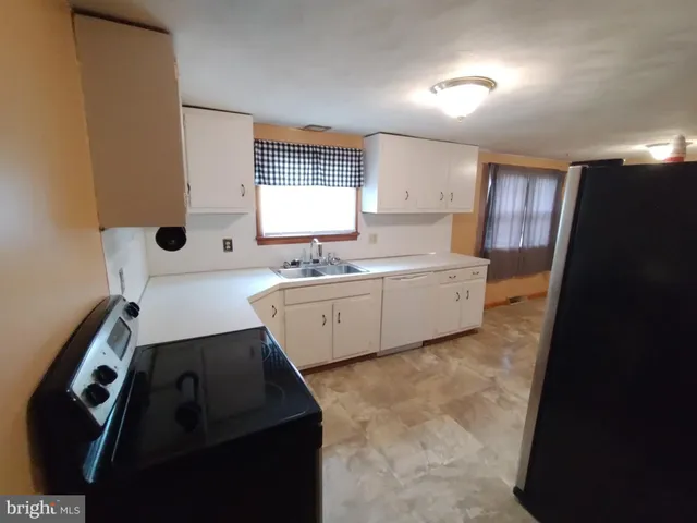 a bathroom with a sink a mirror and a bathtub