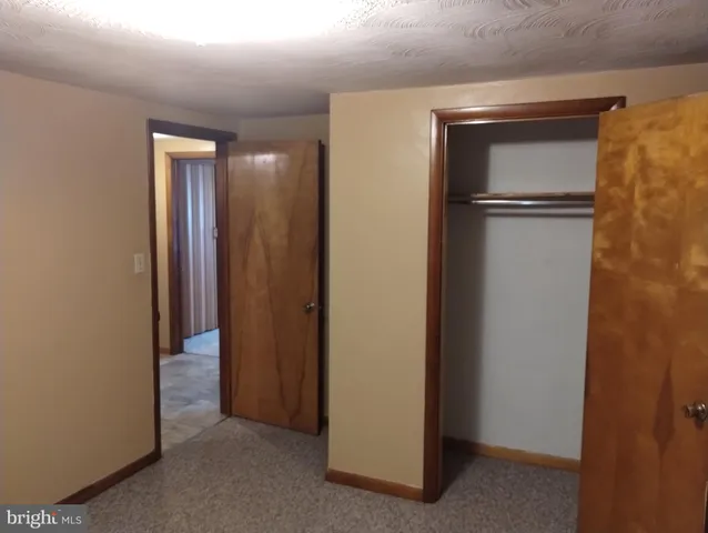 a view of hallway with closet