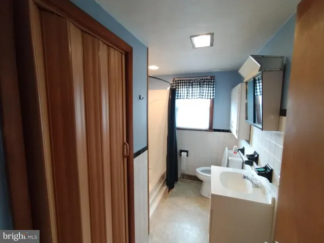 a bathroom with a sink a mirror and a bathtub