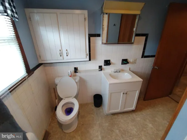 a bathroom with a sink and toilet