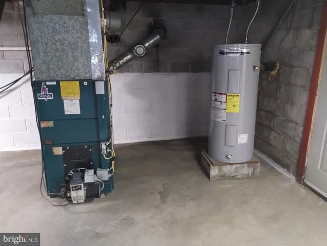 an empty room with a fireplace and a window