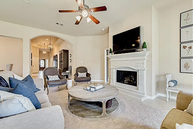 a spacious bedroom with a large bed and a large window