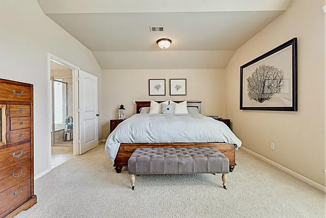a bathroom with a tub shower and toilet