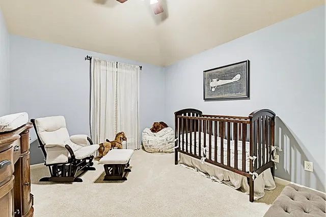 a living room with furniture a couch and a window