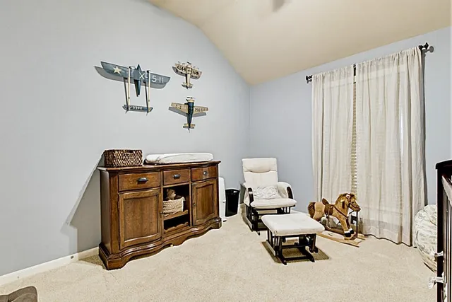 a bedroom with a bed and dresser