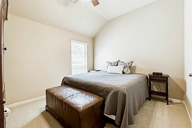 a bathroom with a sink a toilet and a large mirror