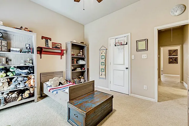 a bathroom with a granite countertop sink toilet and a mirror